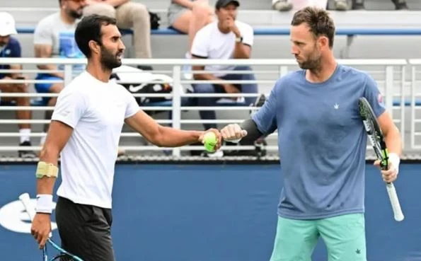 India's Yuki Bhambri (left) and New Zealand's Michael Venus